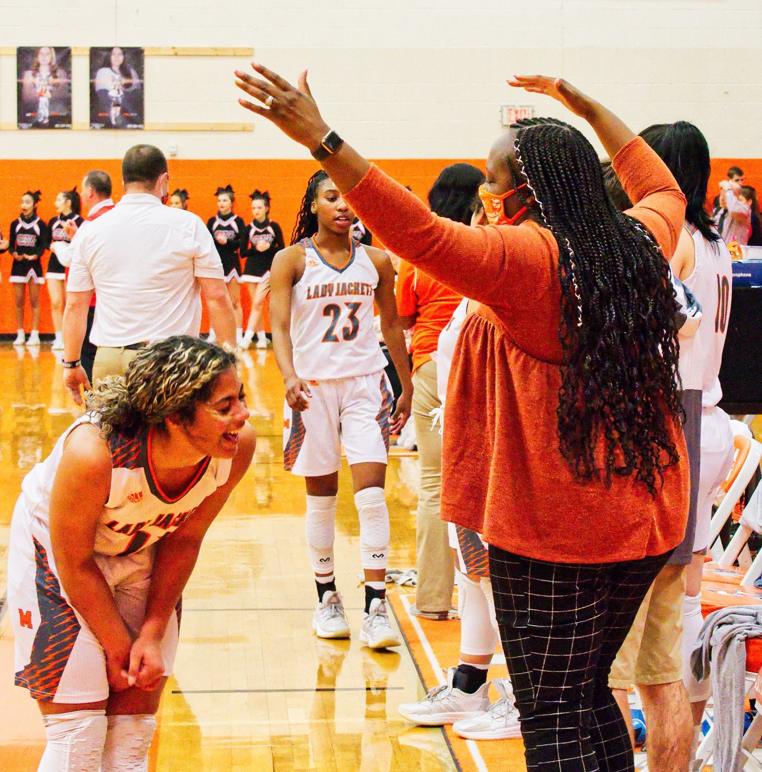 Jayden Gardner is amused by coach TaShara Stephens as Gardner and her fellow seniors are subbed out in the final minute. [more shots, plus prints]